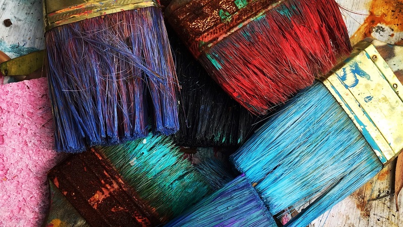 Paint brushes of various colours.